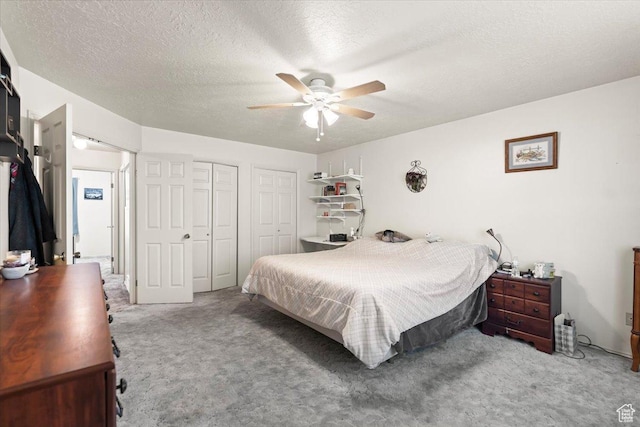 214 N Mountain Rd, Fruit Heights, UT 84037 - bedroom featuring a textured ceiling, multiple closets, carpet flooring, and a ceiling fan