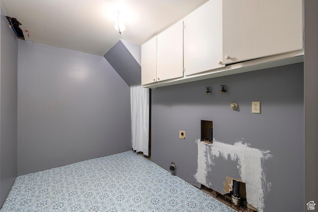 laundry area featuring electric dryer hookup, cabinet space, hookup for a gas dryer, and washer hookup