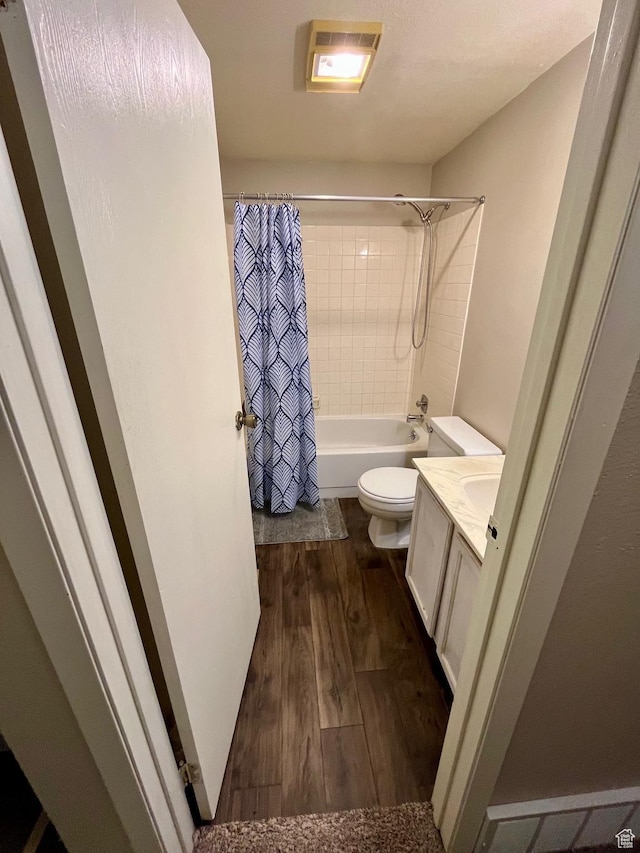 440 S 400 W, Preston, ID 83263 - full bath featuring toilet, visible vents, wood finished floors, shower / bathtub combination with curtain, and vanity