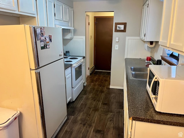 440 S 400 W, Preston, ID 83263 - kitchen with dark wood-style floors, a sink, white appliances, baseboards, and white cabinetry