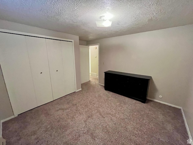 440 S 400 W, Preston, ID 83263 - unfurnished bedroom with a textured ceiling, a closet, carpet flooring, and baseboards