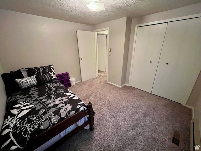 440 S 400 W, Preston, ID 83263 - bedroom with baseboards, carpet flooring, a textured ceiling, and a closet