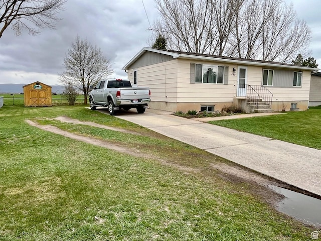 440 S 400 W, Preston, ID 83263 - ranch-style house featuring concrete driveway, a front lawn, an outbuilding, and a storage shed