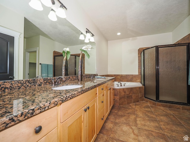 851 E Oak Ct Unit 28, Tooele, UT 84074 - full bathroom with double vanity, a garden tub, a stall shower, and a sink