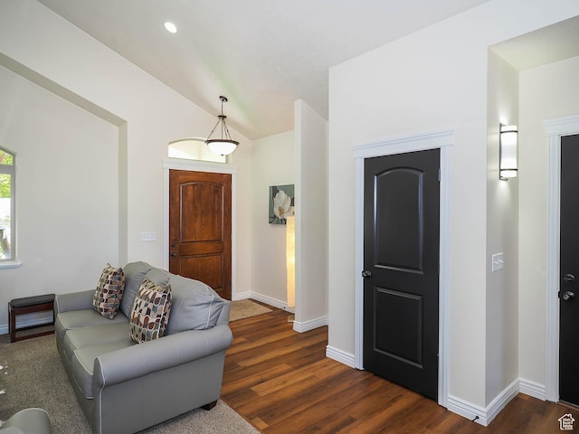 851 E Oak Ct Unit 28, Tooele, UT 84074 - living area featuring vaulted ceiling, baseboards, and dark wood-type flooring