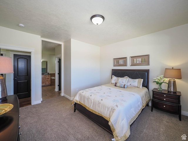 851 E Oak Ct Unit 28, Tooele, UT 84074 - bedroom with baseboards, carpet flooring, and ensuite bathroom