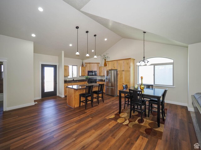 851 E Oak Ct Unit 28, Tooele, UT 84074 - dining area with dark wood-type flooring, a wealth of natural light, high vaulted ceiling, and an inviting chandelier