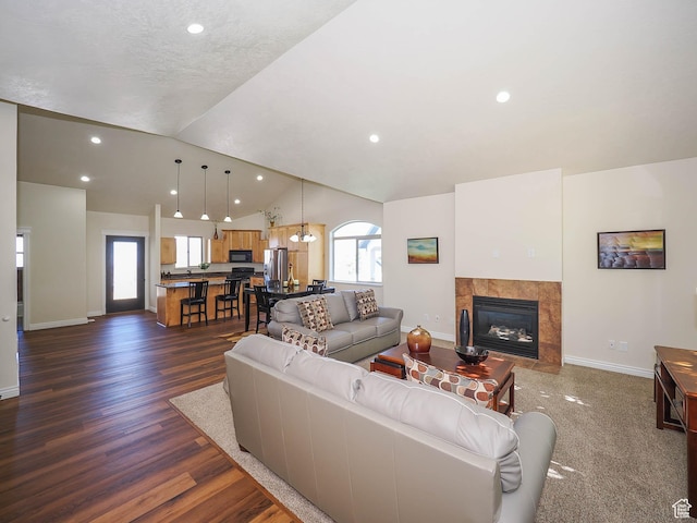 851 E Oak Ct Unit 28, Tooele, UT 84074 - living room with recessed lighting, vaulted ceiling, and baseboards