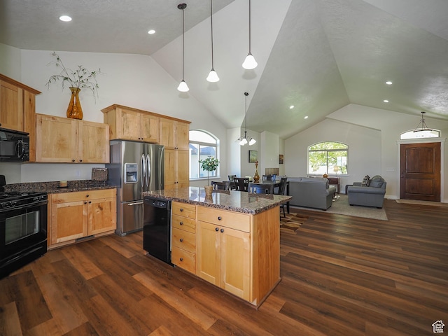 851 E Oak Ct Unit 28, Tooele, UT 84074 - kitchen with lofted ceiling, a kitchen island, black appliances, and dark wood finished floors