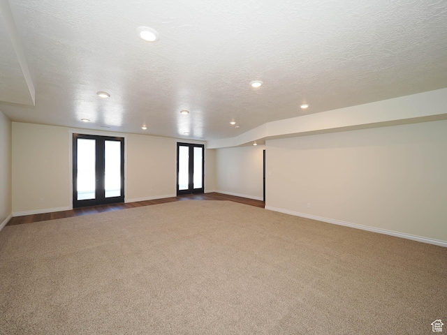 851 E Oak Ct Unit 28, Tooele, UT 84074 - spare room featuring baseboards, light carpet, a textured ceiling, and recessed lighting