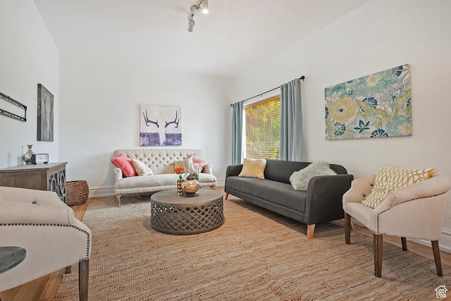 731 E Roosevelt Ave, Salt Lake City, UT 84105 - living room featuring track lighting, wood finished floors, and baseboards