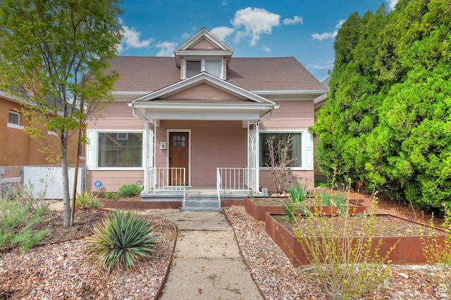 731 E Roosevelt Ave, Salt Lake City, UT 84105 - view of front of house featuring a garden, a porch, and roof with shingles