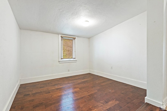731 E Roosevelt Ave, Salt Lake City, UT 84105 - unfurnished room with a textured ceiling, baseboards, visible vents, and dark wood-style floors