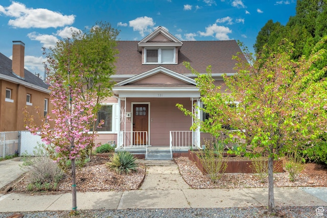 731 E Roosevelt Ave, Salt Lake City, UT 84105 - view of front facade featuring a porch and a shingled roof