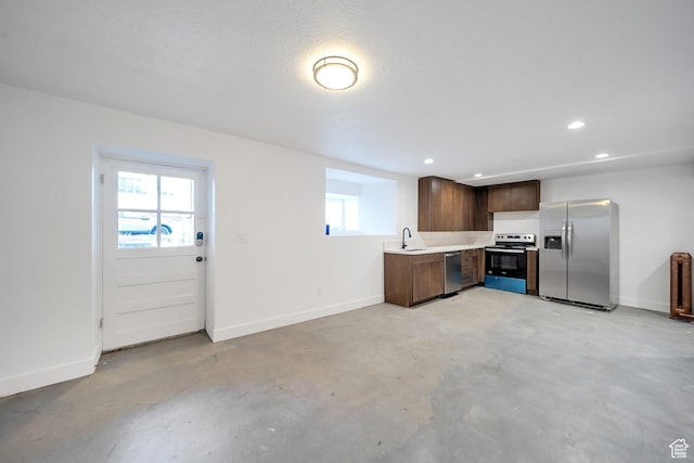 480 N 300 W, Salt Lake City, UT 84103 - kitchen with a sink, concrete flooring, a healthy amount of sunlight, light countertops, and appliances with stainless steel finishes
