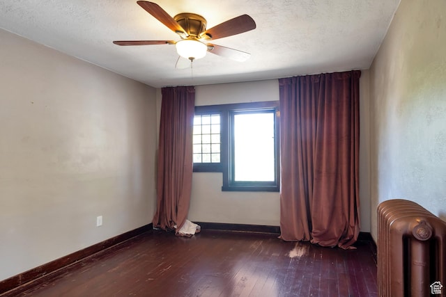 480 N 300 W, Salt Lake City, UT 84103 - unfurnished room featuring radiator heating unit, baseboards, ceiling fan, and dark wood finished floors