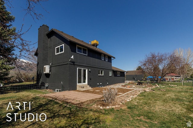 3116 N River Dr E, Eden, UT 84310 - rear view of house with a chimney, fence, entry steps, and a lawn