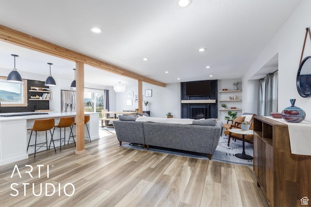3116 N River Dr E, Eden, UT 84310 - living area with beamed ceiling, a fireplace, recessed lighting, and light wood-style floors