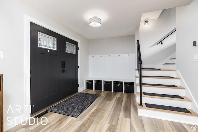 3116 N River Dr E, Eden, UT 84310 - foyer with wood finished floors and stairs