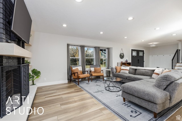 3116 N River Dr E, Eden, UT 84310 - living area with light wood finished floors, stairway, recessed lighting, and a high end fireplace