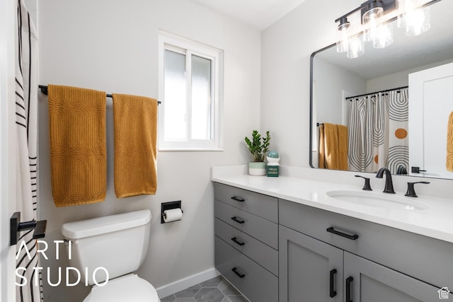 3116 N River Dr E, Eden, UT 84310 - full bathroom featuring tile patterned floors, baseboards, vanity, and toilet