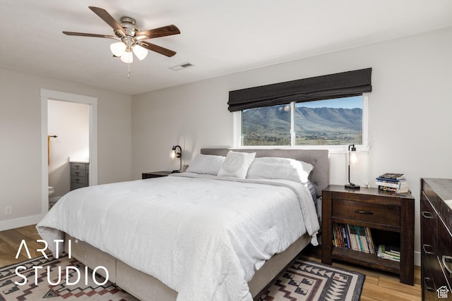3116 N River Dr E, Eden, UT 84310 - bedroom featuring wood finished floors, visible vents, connected bathroom, and a ceiling fan