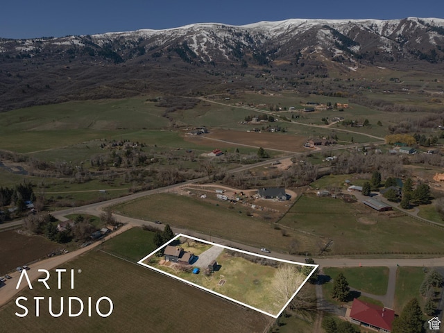 birds eye view of property featuring a rural view and a mountain view