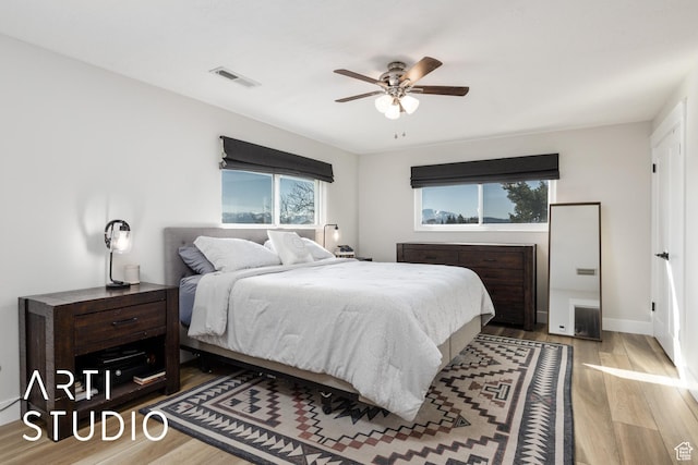 3116 N River Dr E, Eden, UT 84310 - bedroom with wood finished floors, visible vents, a ceiling fan, and multiple windows