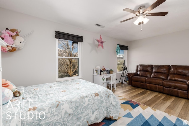 3116 N River Dr E, Eden, UT 84310 - bedroom featuring a ceiling fan, wood finished floors, and visible vents