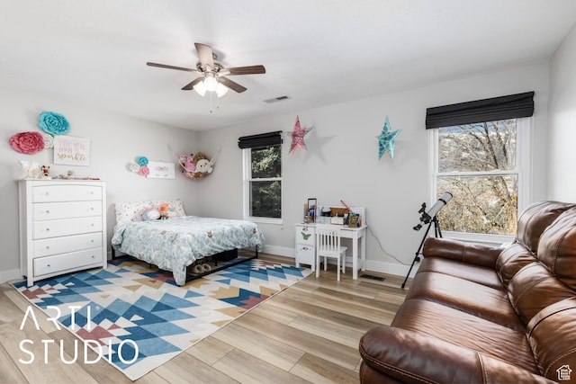 3116 N River Dr E, Eden, UT 84310 - bedroom with visible vents, light wood finished floors, baseboards, and ceiling fan