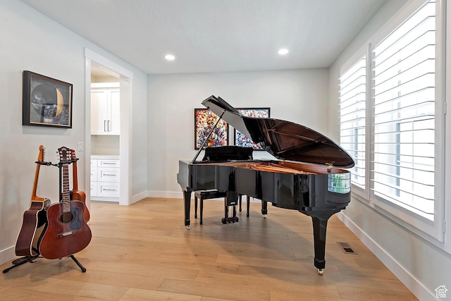 sitting room featuring baseboards, visible vents, recessed lighting, and light wood-style floors