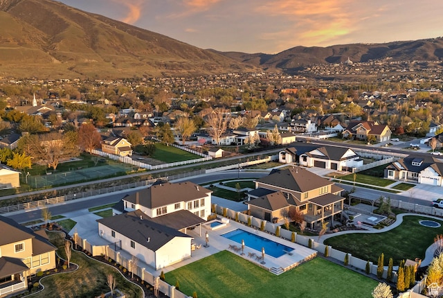 birds eye view of property featuring a mountain view and a residential view