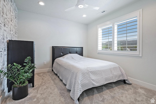 carpeted bedroom featuring baseboards, a ceiling fan, visible vents, and recessed lighting