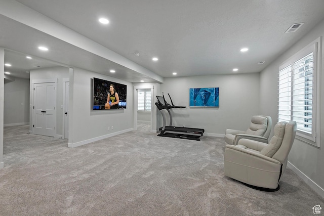 exercise room with baseboards, carpet flooring, visible vents, and recessed lighting