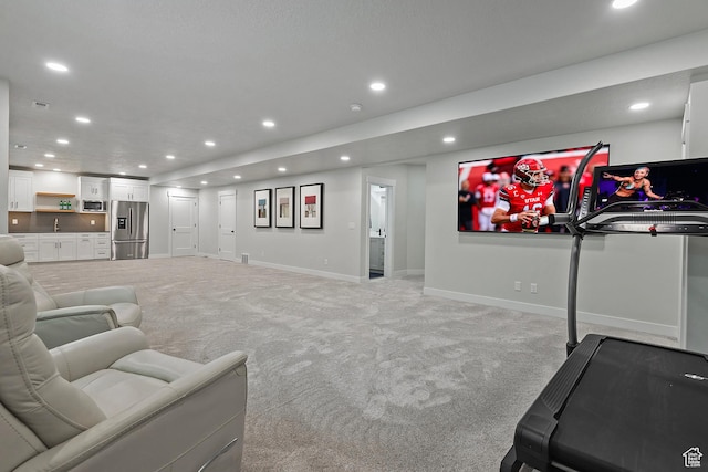 living room with light carpet, baseboards, and recessed lighting
