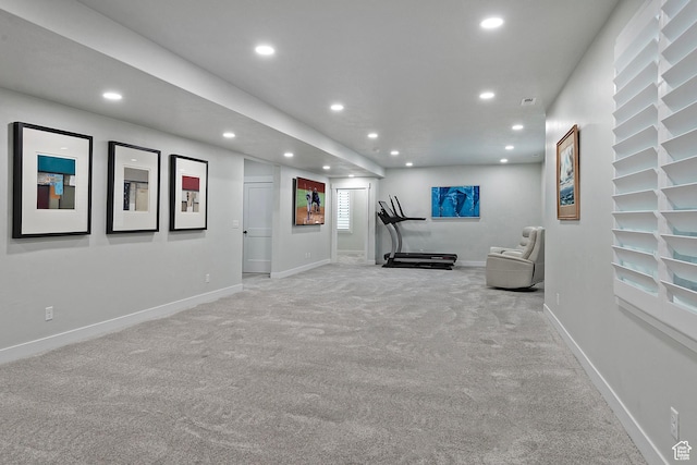 exercise area featuring visible vents, light carpet, baseboards, and recessed lighting