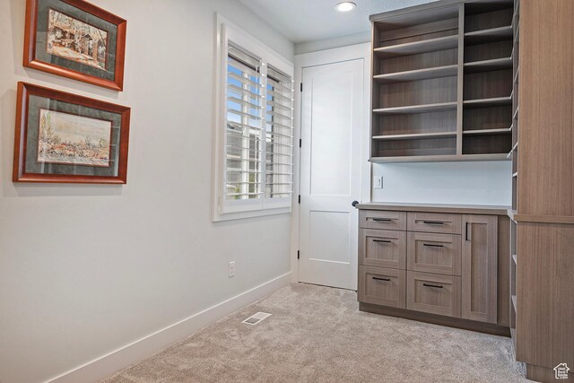 unfurnished office featuring visible vents, light carpet, baseboards, and recessed lighting