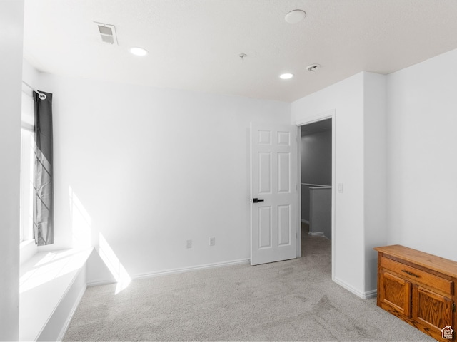 6939 S Tourist Ln W Unit 2C, West Jordan, UT 84084 - unfurnished bedroom featuring light colored carpet, baseboards, and recessed lighting