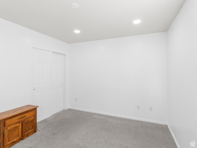 6939 S Tourist Ln W Unit 2C, West Jordan, UT 84084 - unfurnished room with baseboards, light carpet, and recessed lighting