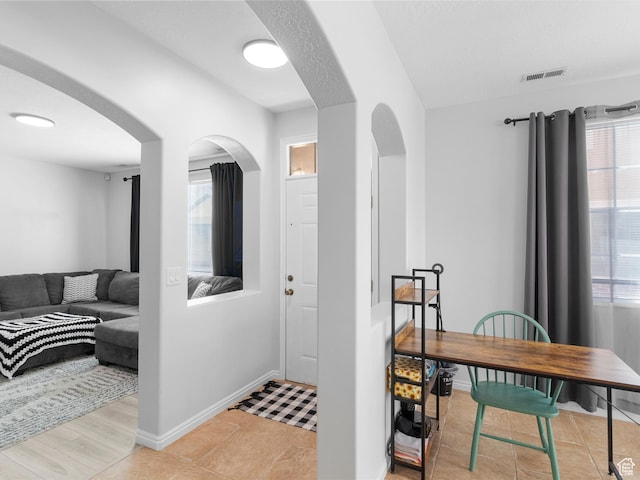 6939 S Tourist Ln W Unit 2C, West Jordan, UT 84084 - interior space featuring arched walkways, a wealth of natural light, visible vents, and baseboards
