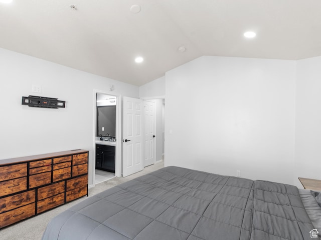 6939 S Tourist Ln W Unit 2C, West Jordan, UT 84084 - bedroom featuring a sink, connected bathroom, light carpet, lofted ceiling, and recessed lighting