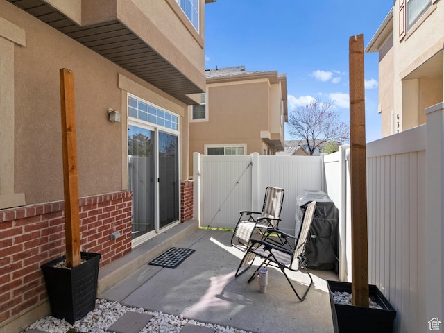 6939 S Tourist Ln W Unit 2C, West Jordan, UT 84084 - view of patio featuring a fenced backyard and a gate