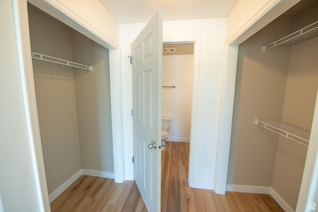 spacious closet featuring wood finished floors