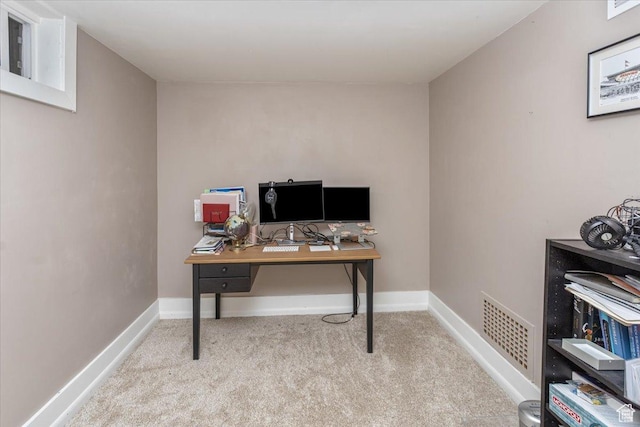 carpeted home office featuring baseboards and visible vents