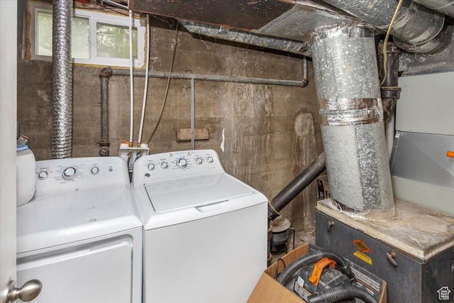washroom with washer and clothes dryer and laundry area