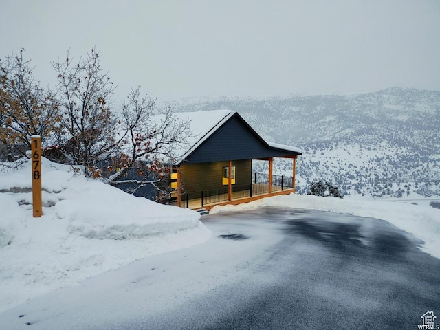 1678 S Ridgeline Dr Unit 1276, Heber City, UT 84032 - snow covered property featuring a mountain view and a porch
