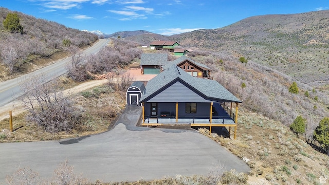 1678 S Ridgeline Dr Unit 1276, Heber City, UT 84032 - view of front of house featuring a mountain view, a shingled roof, and covered porch