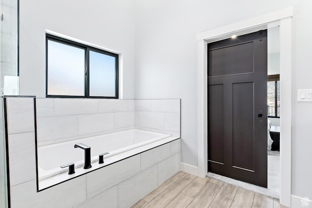 1678 S Ridgeline Dr Unit 1276, Heber City, UT 84032 - full bath featuring baseboards, a garden tub, and wood finished floors