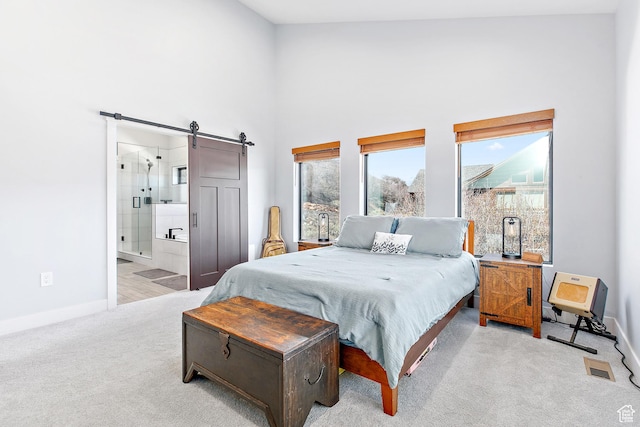 1678 S Ridgeline Dr Unit 1276, Heber City, UT 84032 - bedroom with a barn door, baseboards, a towering ceiling, and carpet