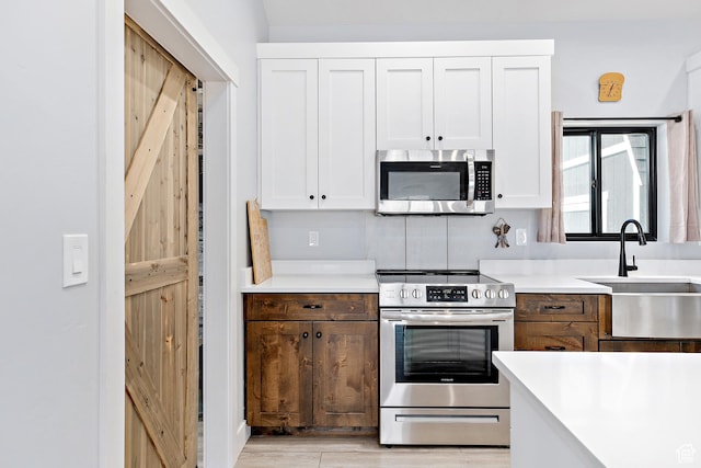 1678 S Ridgeline Dr Unit 1276, Heber City, UT 84032 - kitchen with white cabinets, stainless steel appliances, and a sink